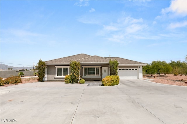 single story home with a garage