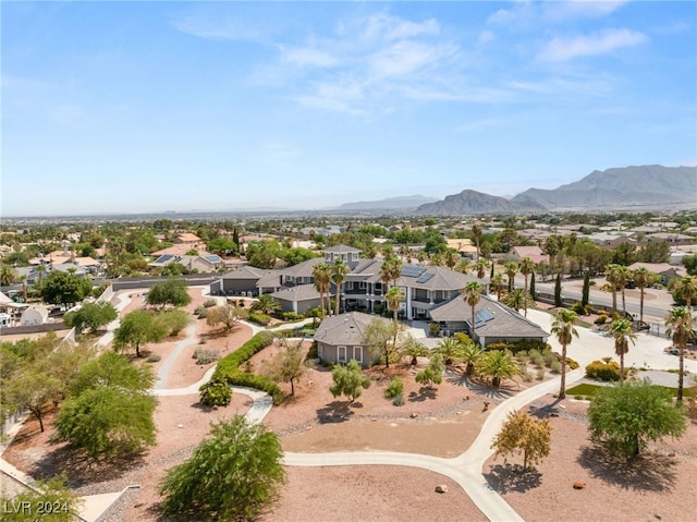 birds eye view of property with a mountain view