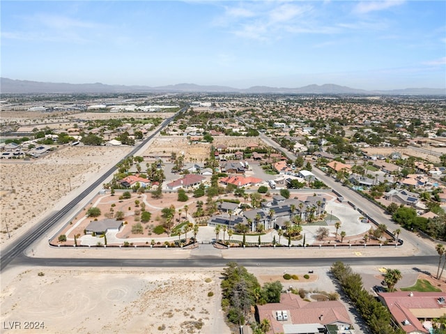 birds eye view of property featuring a mountain view