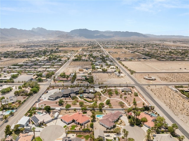 birds eye view of property with a mountain view