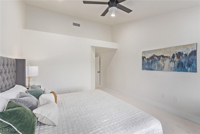 carpeted bedroom with a ceiling fan, baseboards, and visible vents