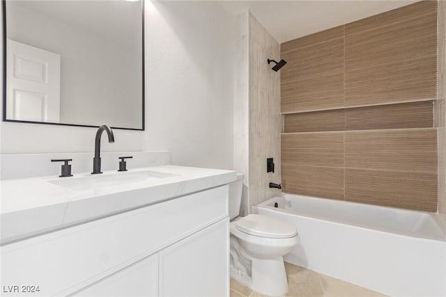 bathroom featuring tile patterned floors, vanity, toilet, and washtub / shower combination