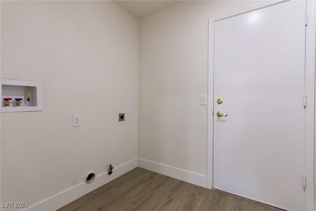 laundry area with laundry area, hookup for a washing machine, hookup for a gas dryer, wood finished floors, and hookup for an electric dryer