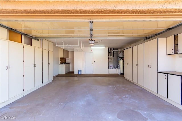 garage with heating unit, a garage door opener, and water heater