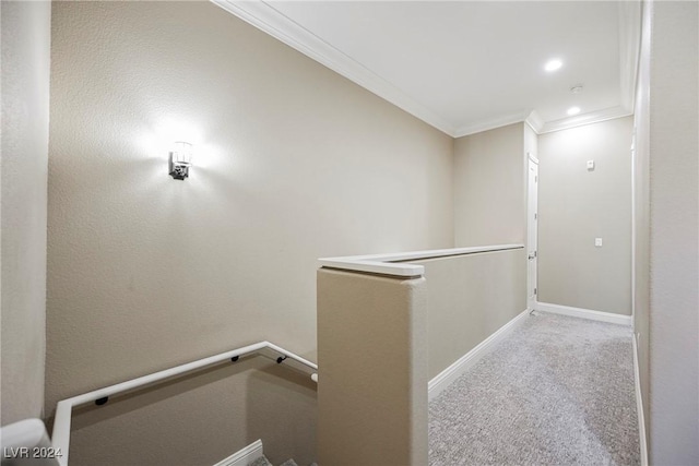 hallway with light carpet, baseboards, ornamental molding, an upstairs landing, and recessed lighting