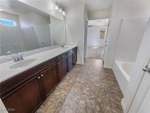 bathroom featuring independent shower and bath and vanity