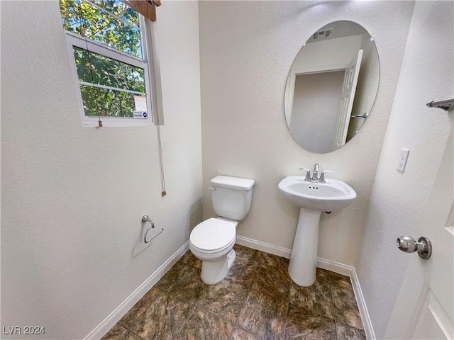 bathroom with sink and toilet