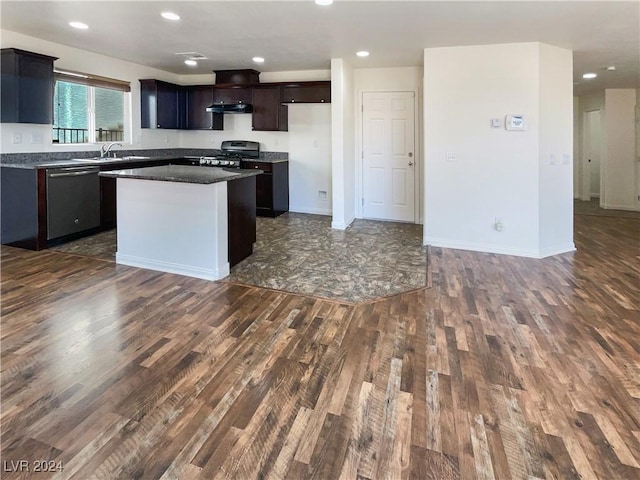 kitchen featuring dark brown cabinets, stainless steel appliances, a center island, dark hardwood / wood-style flooring, and sink