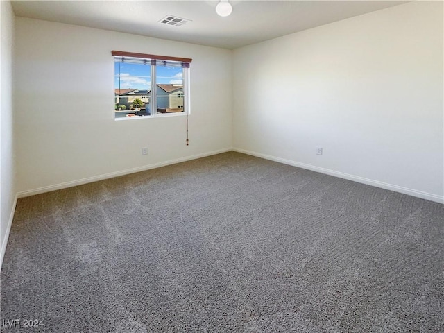 unfurnished room featuring carpet floors