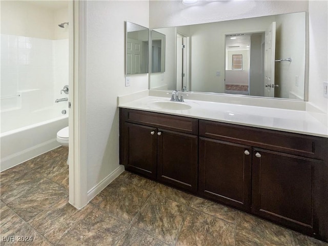 full bathroom featuring vanity, toilet, and washtub / shower combination