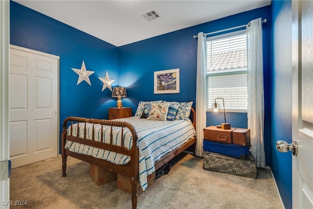 bedroom with carpet floors and visible vents