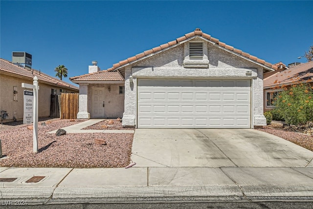 single story home with a garage