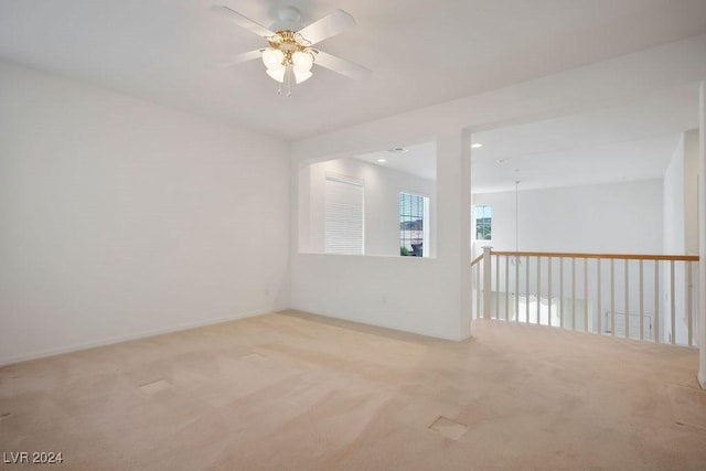 unfurnished room with light carpet, ceiling fan, and recessed lighting