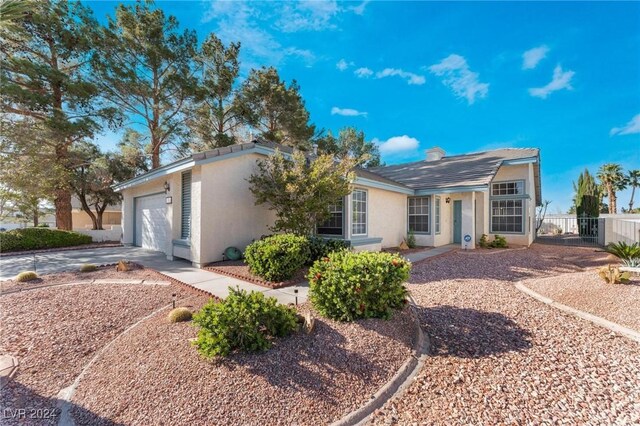 single story home featuring a garage