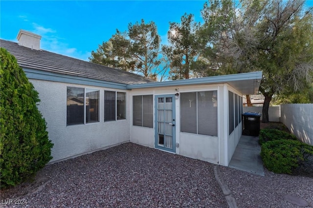 rear view of house with a sunroom