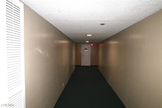 corridor with a textured ceiling