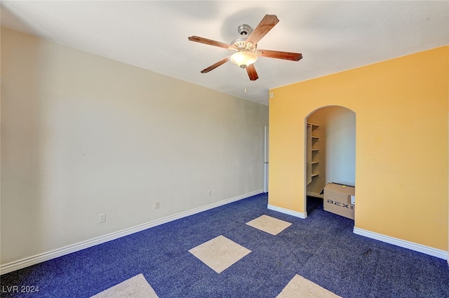 carpeted empty room with ceiling fan