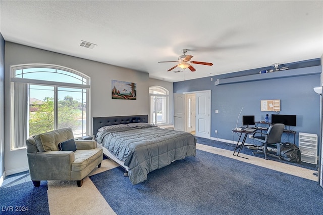 bedroom with ceiling fan and carpet flooring