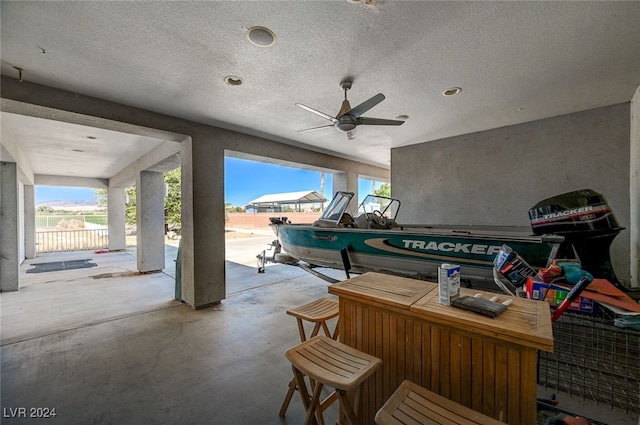 view of patio / terrace featuring ceiling fan