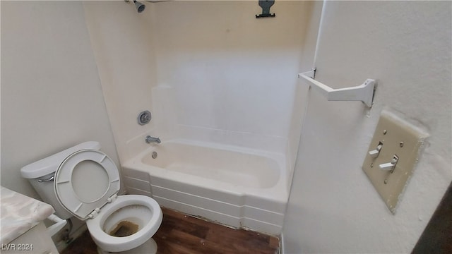 full bathroom with shower / bathing tub combination, hardwood / wood-style flooring, vanity, and toilet