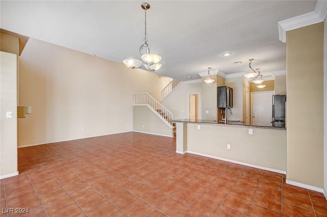 interior space with a sink, baseboards, stairway, and crown molding