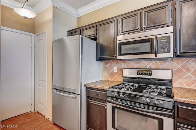 kitchen featuring dark brown cabinetry, appliances with stainless steel finishes, light stone counters, and ornamental molding