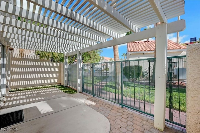 view of patio / terrace with fence, a gate, and a pergola