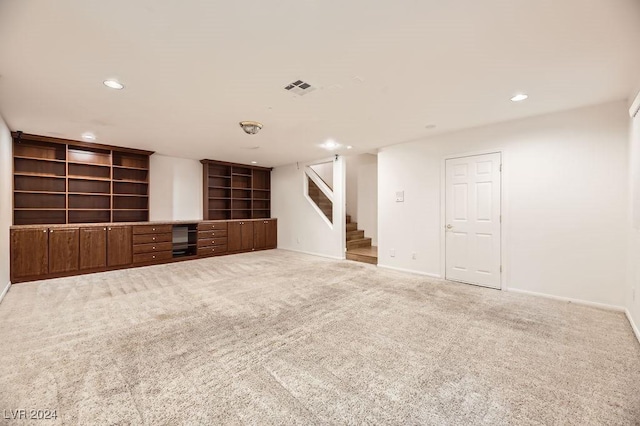 unfurnished living room featuring carpet floors