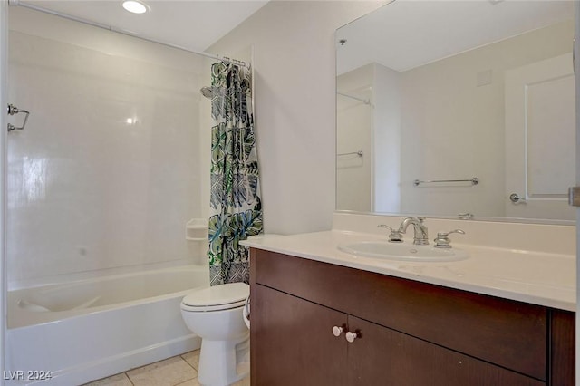 full bath featuring vanity, shower / bath combo with shower curtain, toilet, and tile patterned floors