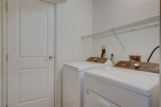 laundry room with laundry area and separate washer and dryer