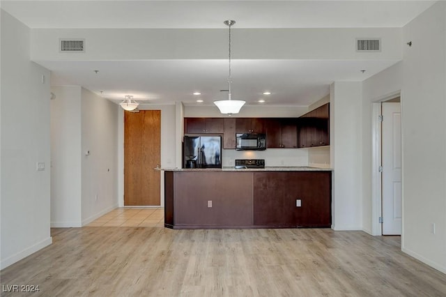 kitchen featuring black appliances, light wood-style flooring, and visible vents