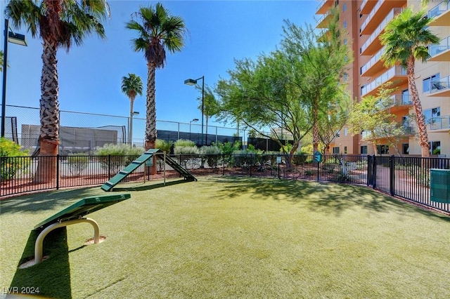 view of home's community with fence