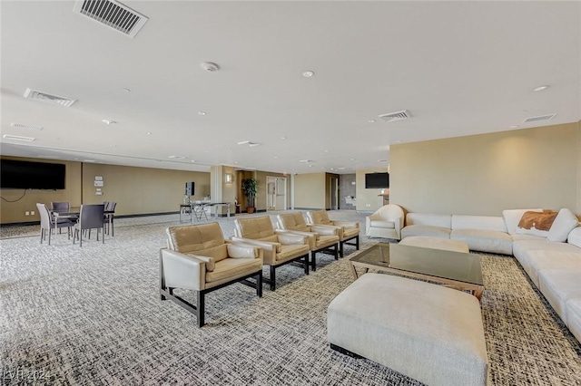 carpeted living area featuring recessed lighting and visible vents