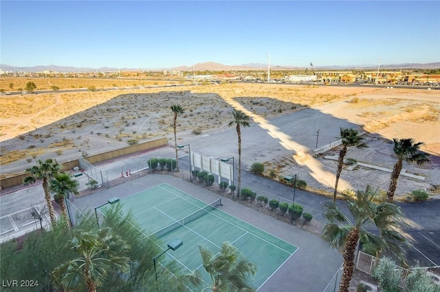 aerial view featuring a desert view and a mountain view