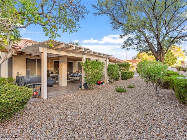 exterior space with a pergola and a patio area