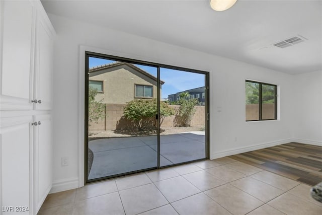 entryway with light hardwood / wood-style floors