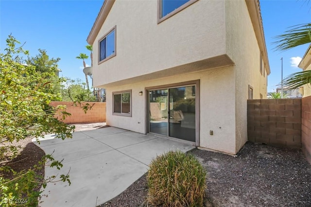 back of property featuring a patio area