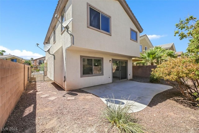 rear view of house with a patio area