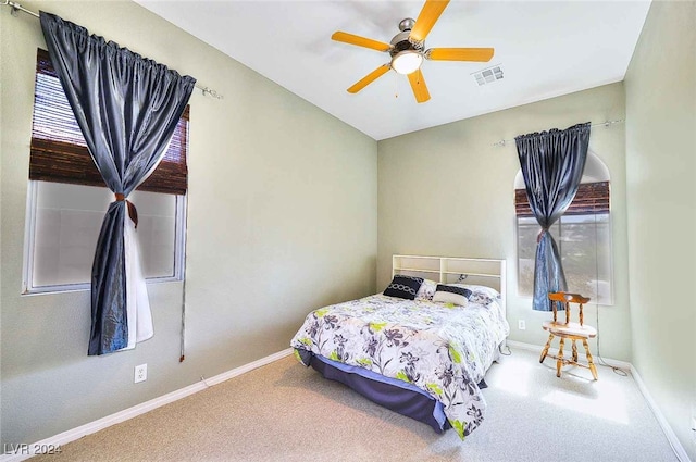 bedroom featuring baseboards, visible vents, and carpet flooring