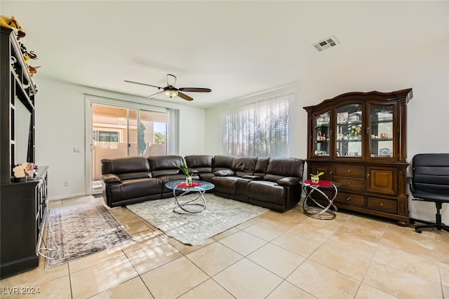 tiled living room featuring ceiling fan