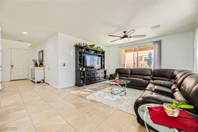 living room with ceiling fan and light tile patterned floors