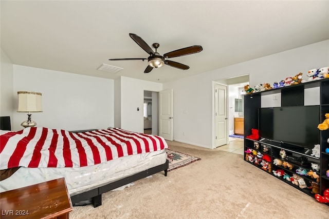 bedroom featuring ceiling fan and light carpet