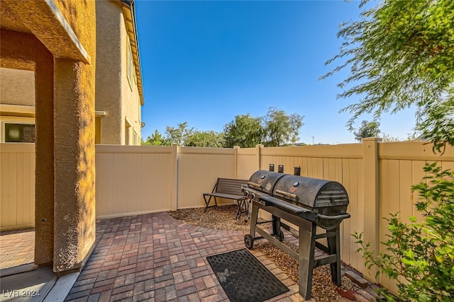 view of patio featuring a grill