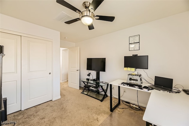 office space with ceiling fan and light colored carpet