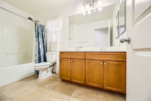 full bathroom with tile patterned floors, vanity, shower / tub combo with curtain, and toilet