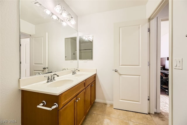 bathroom with tile patterned flooring and vanity