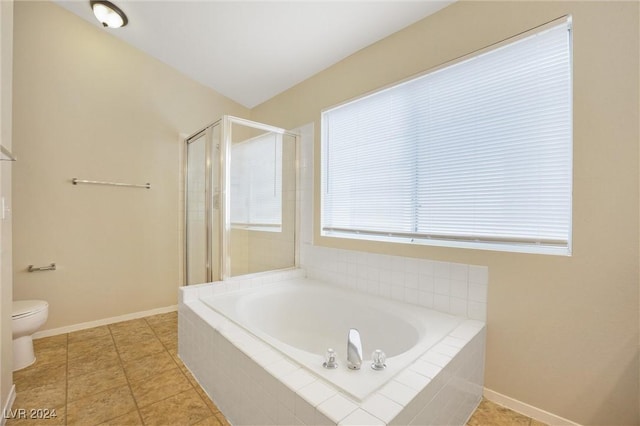 full bath featuring baseboards, toilet, a garden tub, tile patterned flooring, and a shower stall