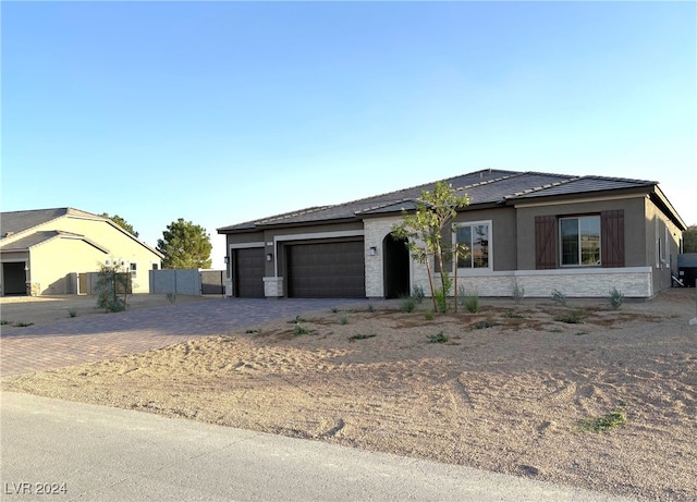 view of front of property featuring a garage