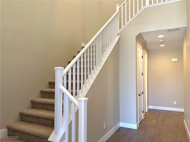 stairway with wood-type flooring