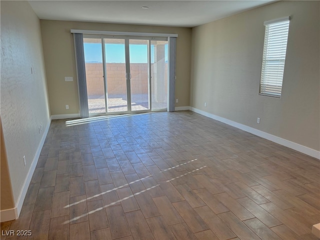 unfurnished room with hardwood / wood-style floors